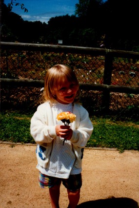 Young Emily holding carnations