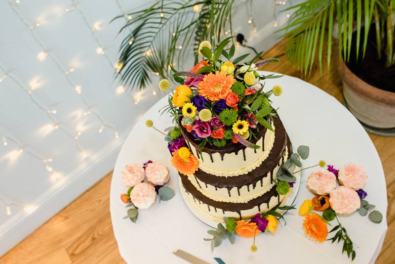 Colourful flowers on wedding cake