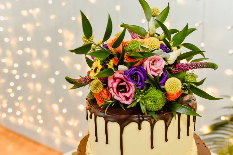 Colourful flowers on wedding cake