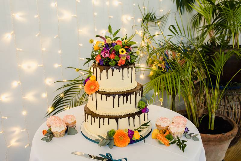 Colourful flowers on wedding cake