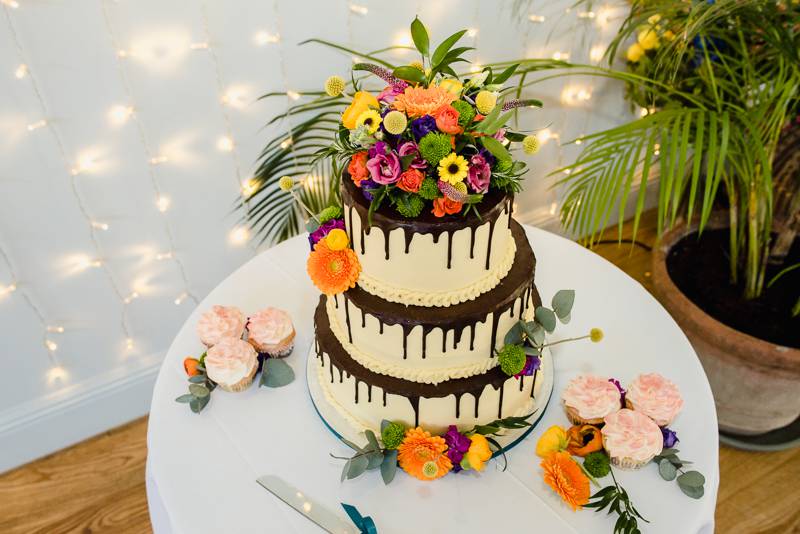 Colourful flowers on wedding cake